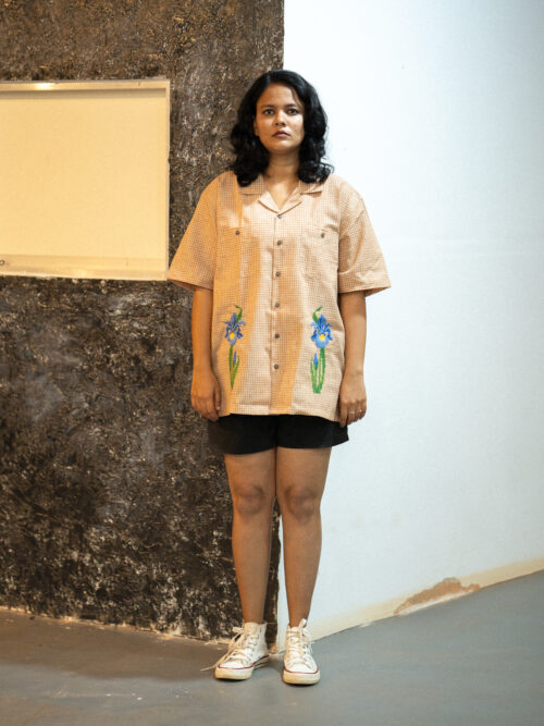 Cross stitch embroidered flower shirt.