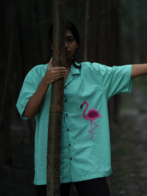 Cross stitch embroidered flamingo shirt.