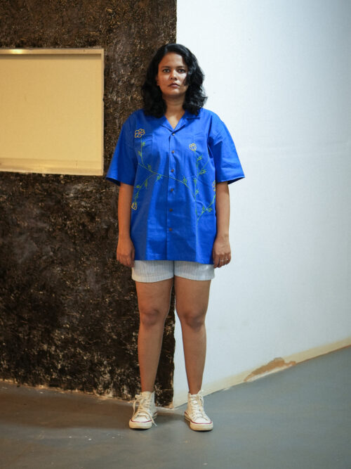 Hand embroidered flower shirt.